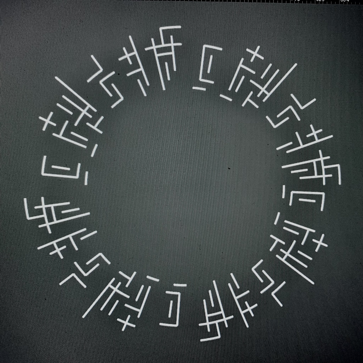 The text before, written in griddish four times to form a circle.